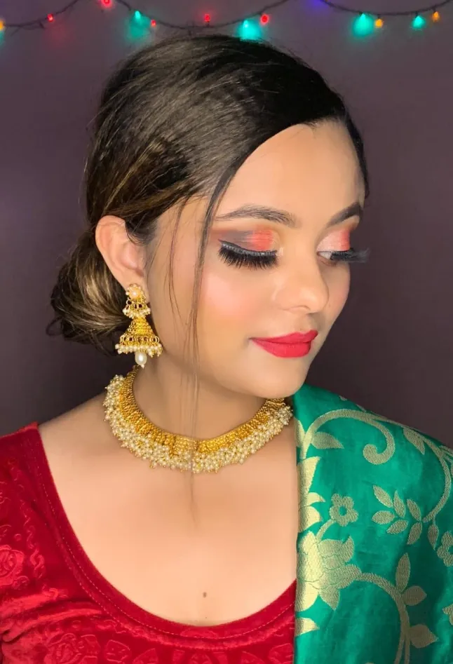 Soft glam with a green saree and gold jewellery