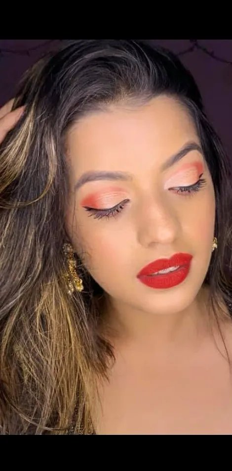 Soft glam look with a bold red lip